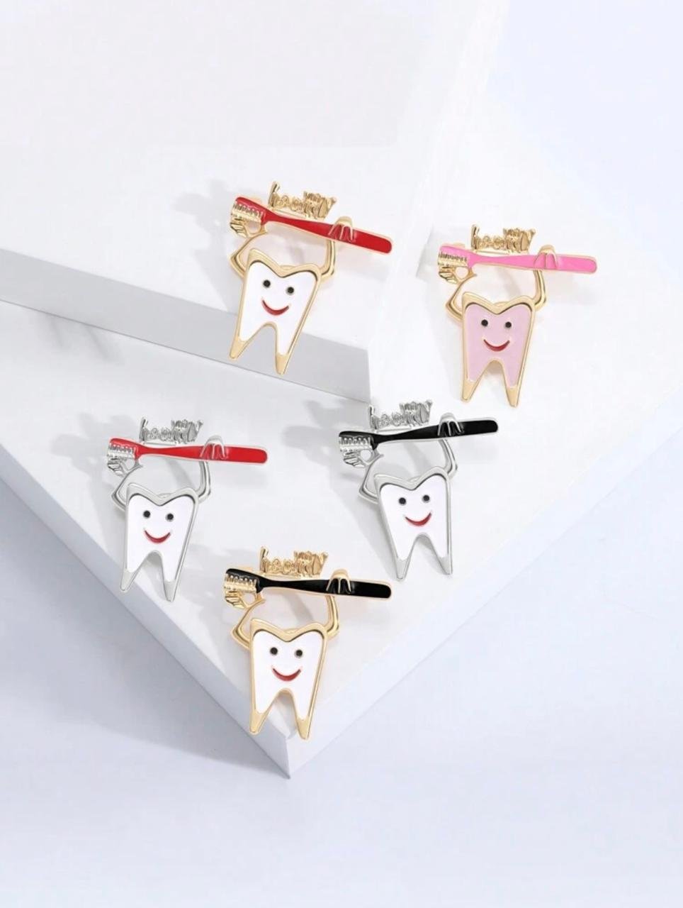 PRENDEDOR - CEPILLO CON MUELA COLGANTE